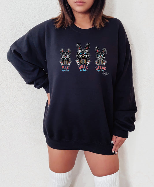Salish Grant - See Hear Speak No Evil Sweatshirt Coast Salish Art Canadian Streetwear. Three Bunnies in a row across the sweatshirt first covering eyes , second covering ears, third covering mouth Colour Navy Blue